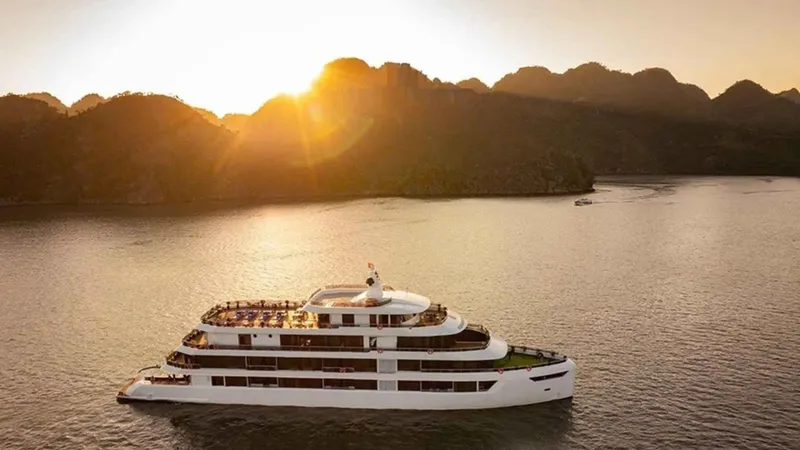 Cruise ship in the evening light on a three-day Ha Long Bay junk boat cruise in Lan Ha Bay, Vietnam