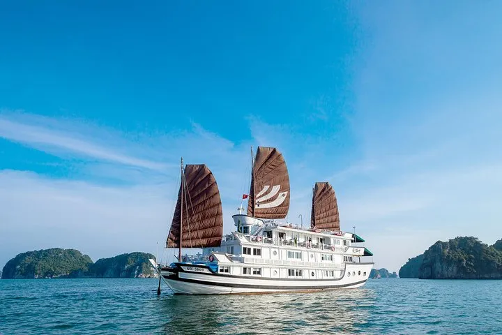 Bhaya Classic boat with red sails among karsts on a two-day Ha Long Bay junk boat cruise, Vietnam