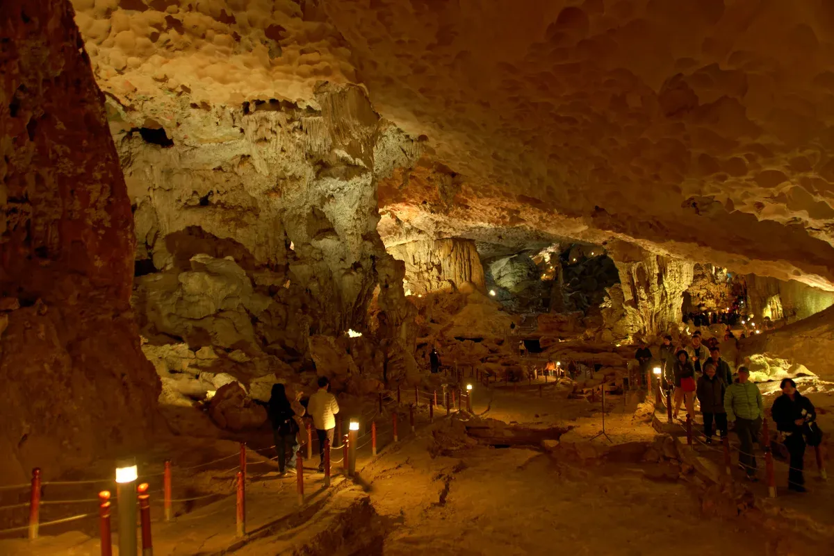 Lit chamber of Sung Sot Cave, a stop on a Ha Long Bay junk boat cruise