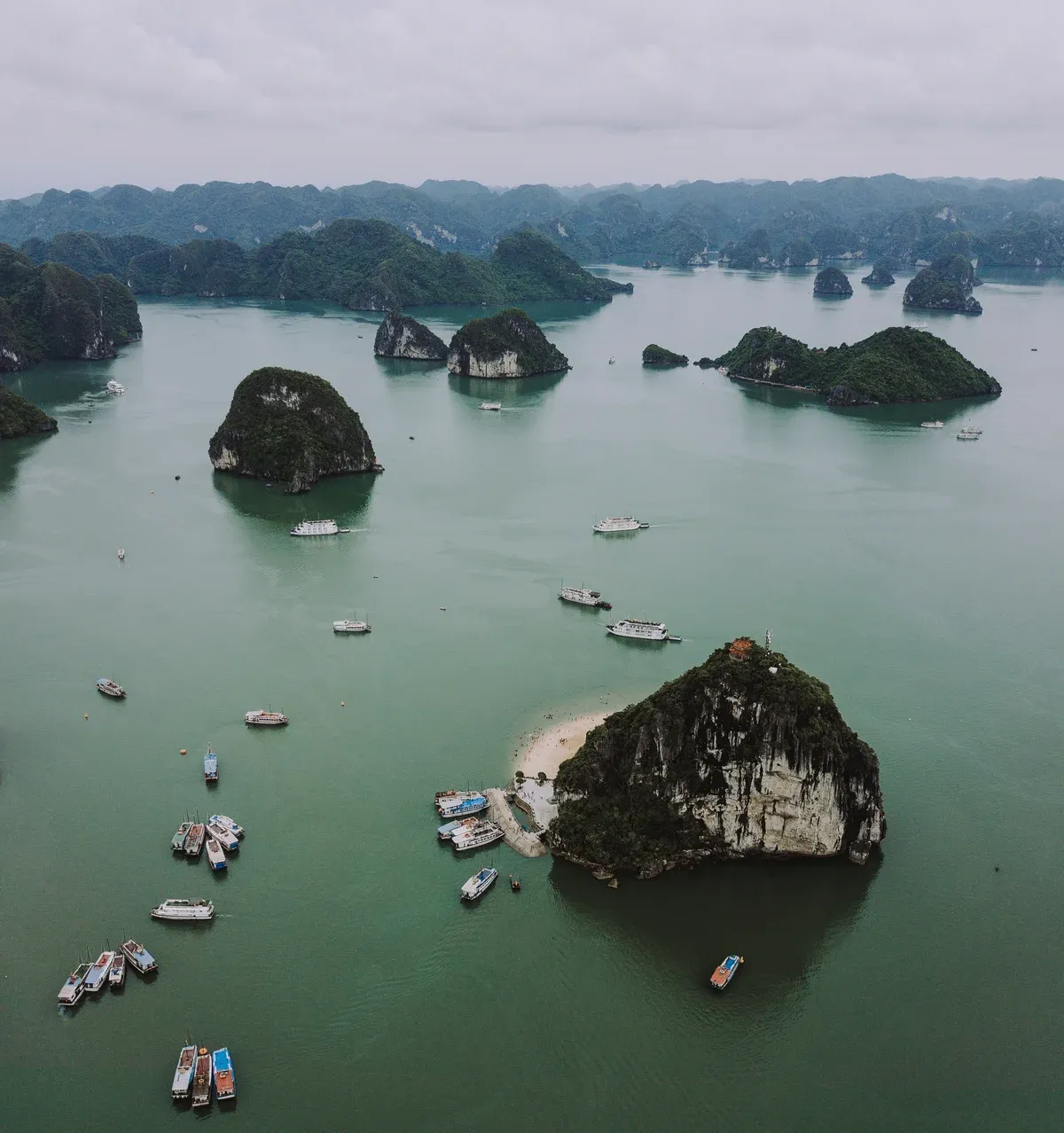 Aerial view of Ti Top Island and small boats in Ha Long Bay, Halong Bay cruise
